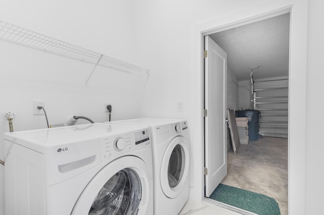 laundry room featuring washing machine and dryer