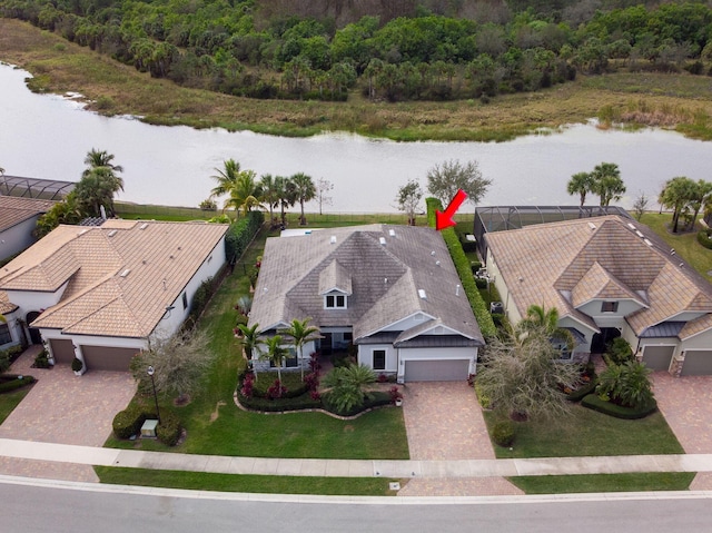 birds eye view of property featuring a water view