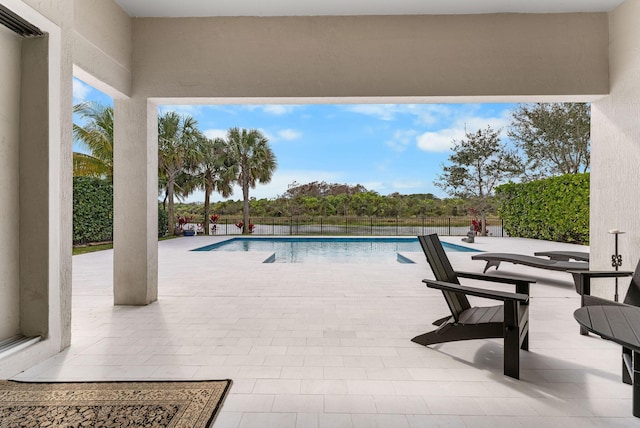 view of swimming pool with a patio and a fenced in pool