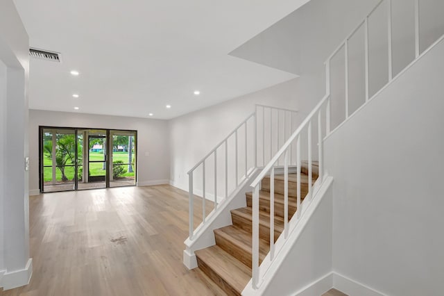 stairway with wood-type flooring