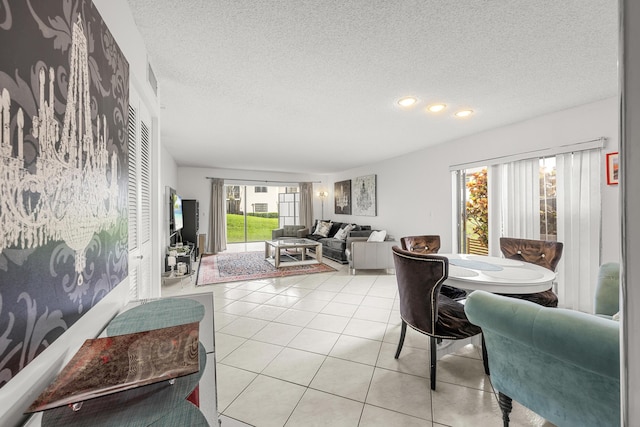 living room with light tile patterned flooring and a textured ceiling