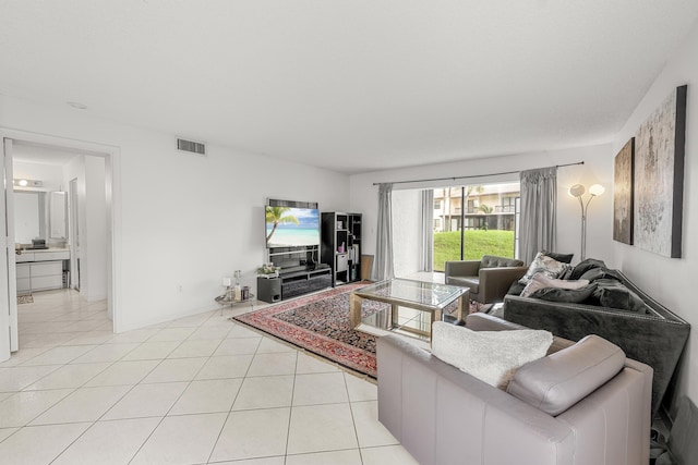 living room with light tile patterned flooring