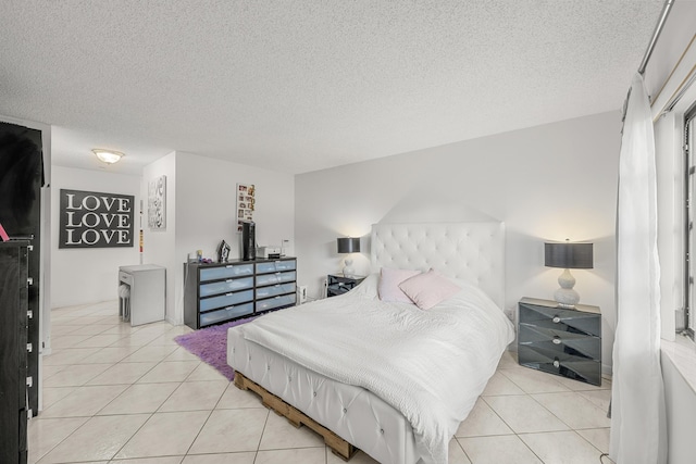 tiled bedroom with a textured ceiling