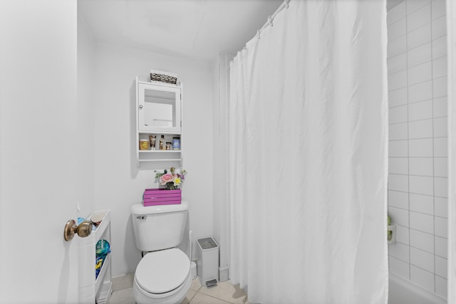 bathroom featuring tile patterned flooring, walk in shower, and toilet