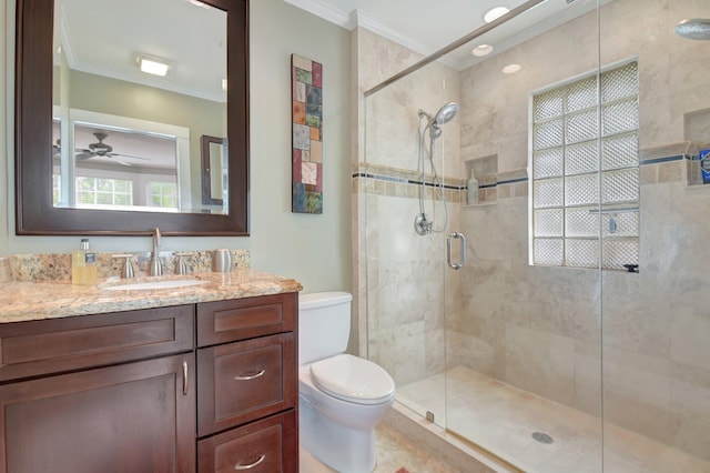 full bath with toilet, ornamental molding, a stall shower, and vanity