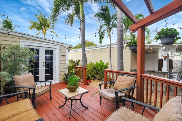 wooden deck featuring french doors