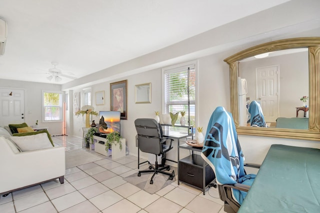 office featuring a ceiling fan, a wealth of natural light, and light tile patterned flooring