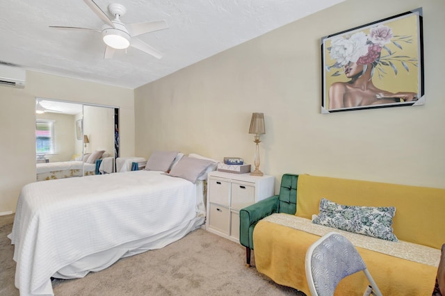 bedroom with a closet, a ceiling fan, an AC wall unit, and light colored carpet