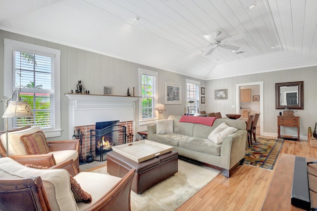 living room featuring light wood-type flooring, wooden ceiling, plenty of natural light, and lofted ceiling