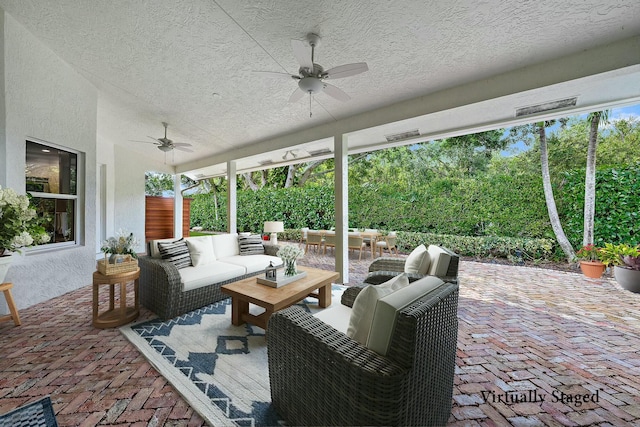 view of patio / terrace featuring ceiling fan and outdoor lounge area