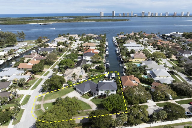 drone / aerial view with a residential view and a water view