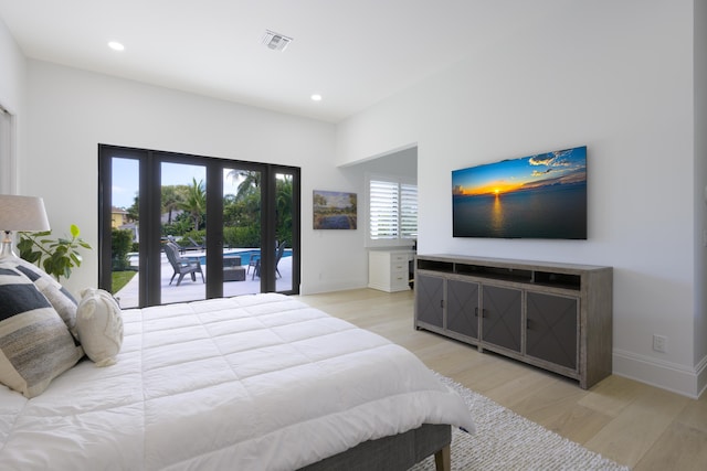 bedroom with visible vents, baseboards, light wood-style flooring, french doors, and recessed lighting