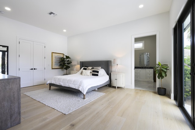 bedroom with visible vents, light wood-style flooring, and recessed lighting