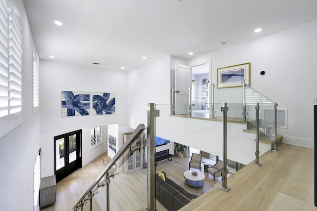 interior space with plenty of natural light, visible vents, wood finished floors, and recessed lighting