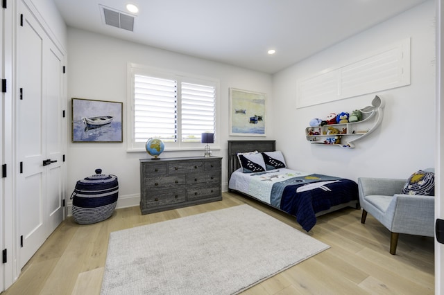 bedroom with recessed lighting, visible vents, baseboards, a closet, and light wood-type flooring