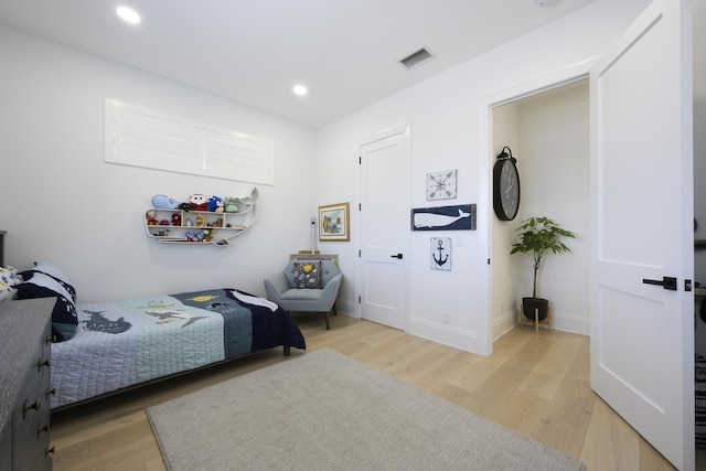 bedroom featuring recessed lighting, baseboards, visible vents, and light wood finished floors