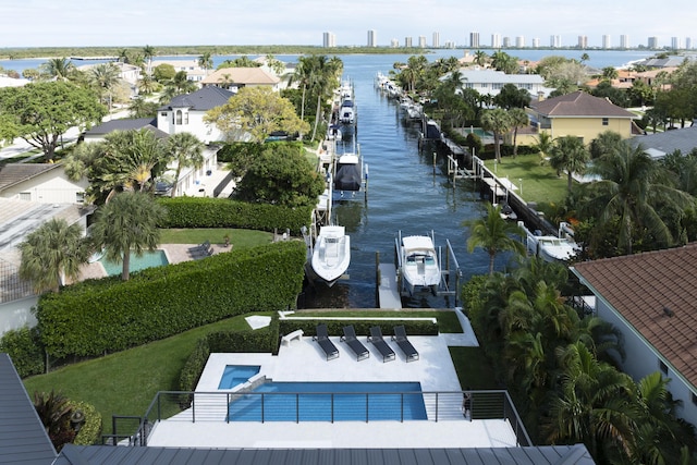 drone / aerial view featuring a water view and a view of city