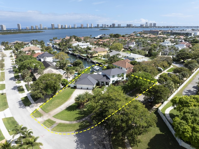 bird's eye view featuring a water view and a view of city