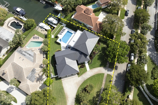 birds eye view of property featuring a water view