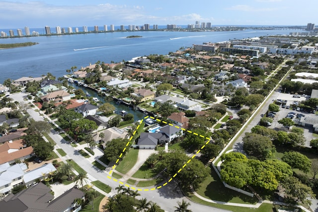 birds eye view of property featuring a view of city and a water view