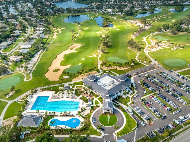 aerial view with view of golf course and a water view