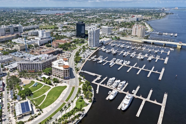 birds eye view of property featuring a water view and a city view