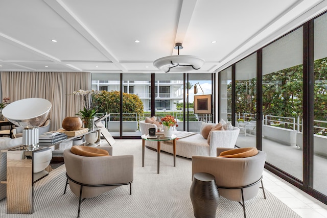 sunroom featuring beam ceiling