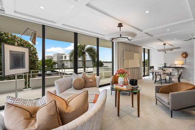 living room featuring coffered ceiling, light colored carpet, beamed ceiling, floor to ceiling windows, and recessed lighting