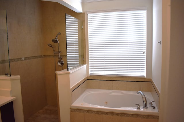 2749 SW Backton Ave, Port Saint Lucie, FL 34987 - bathroom with a jetted tub, walk in shower, and healthy amount of natural light
