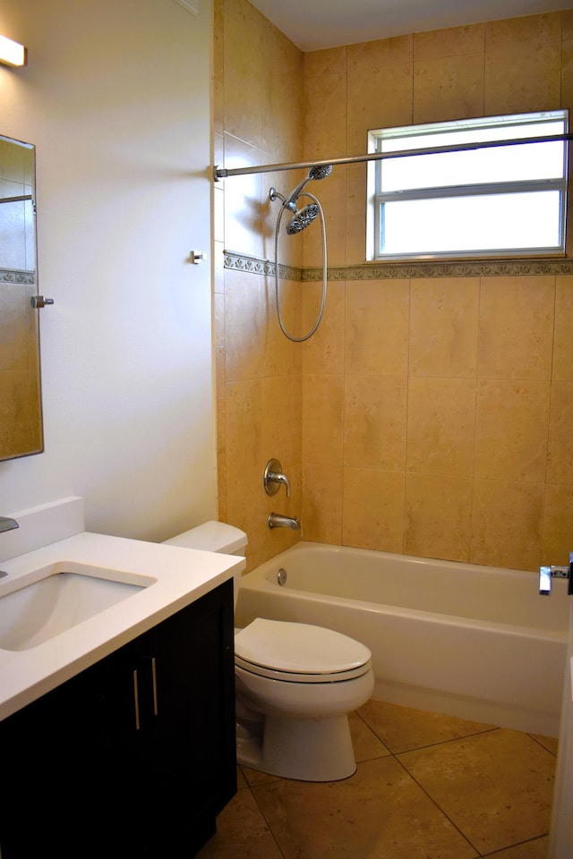 2749 SW Backton Ave, Port Saint Lucie, FL 34987 - full bathroom featuring tile patterned flooring, vanity, shower / washtub combination, and toilet