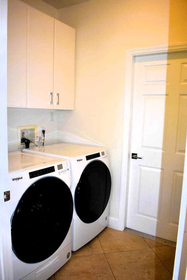 2749 SW Backton Ave, Port Saint Lucie, FL 34987 - laundry room with separate washer and dryer, cabinet space, and light tile patterned flooring