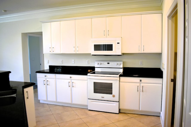 2749 SW Backton Ave, Port Saint Lucie, FL 34987 - kitchen with white appliances, ornamental molding, dark countertops, white cabinetry, and light tile patterned flooring