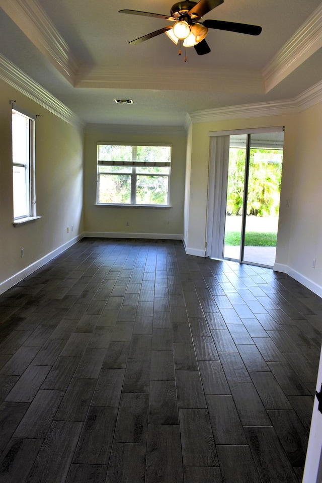 2749 SW Backton Ave, Port Saint Lucie, FL 34987 - unfurnished room with a ceiling fan, a raised ceiling, ornamental molding, dark wood finished floors, and baseboards