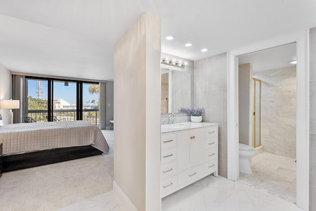 4545 N Ocean Blvd Unit 3A, Boca Raton, FL 33431 - ensuite bathroom with marble look tiles, a stall shower, toilet, recessed lighting, and vanity