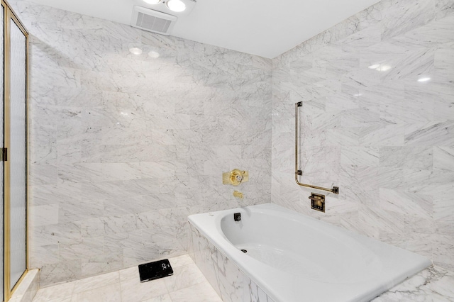 4545 N Ocean Blvd Unit 3A, Boca Raton, FL 33431 - full bathroom with a tub with marble appearance, a shower, tile walls, and marble finish flooring