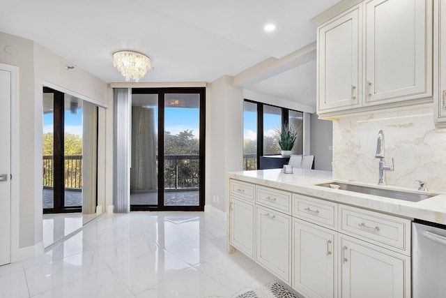 4545 N Ocean Blvd Unit 3A, Boca Raton, FL 33431 - kitchen featuring a sink, dishwasher, decorative backsplash, light stone countertops, and light marble finish floors