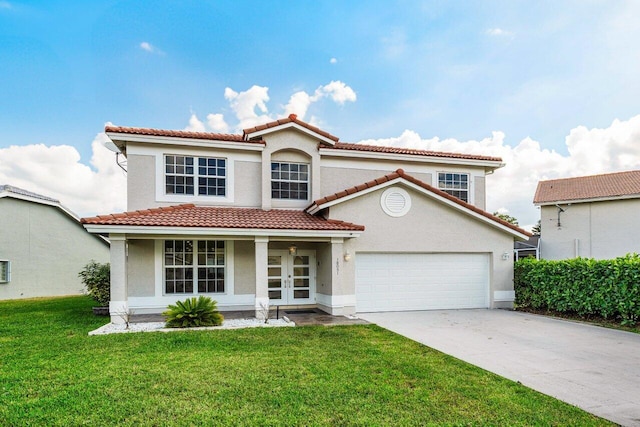 mediterranean / spanish-style home featuring a garage, a front yard, driveway, and stucco siding