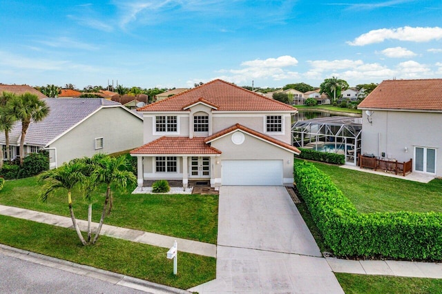 mediterranean / spanish-style home with a lanai, driveway, a front lawn, and a tiled roof