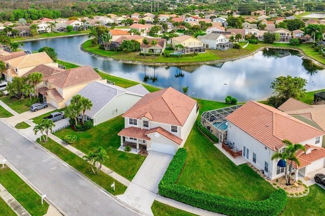 birds eye view of property featuring a residential view and a water view