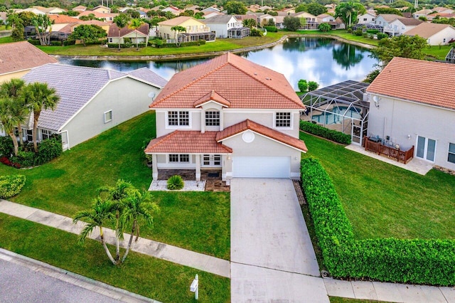 view of front of property featuring a lanai, a water view, a tile roof, stone siding, and driveway