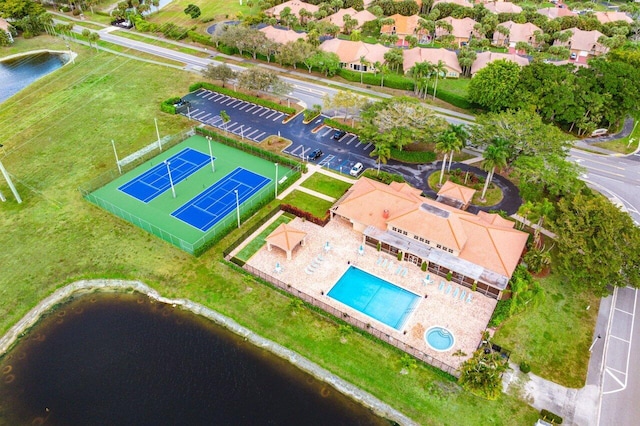 bird's eye view featuring a water view and a residential view