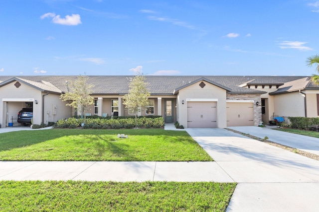 view of front of house featuring a garage and a front yard