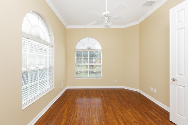 unfurnished room with dark hardwood / wood-style flooring, ornamental molding, and ceiling fan