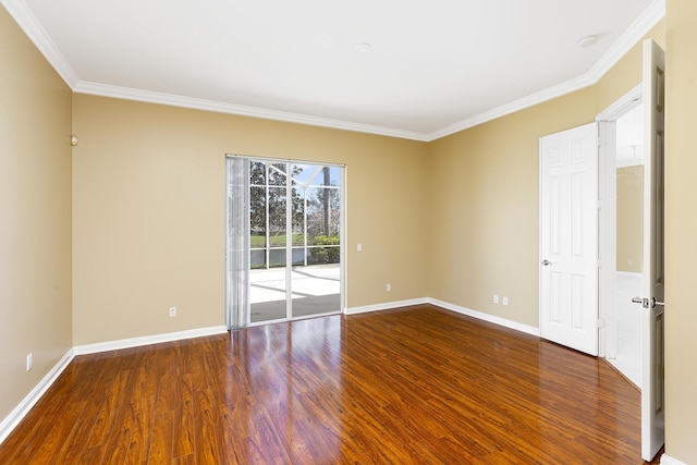 empty room featuring crown molding and hardwood / wood-style floors