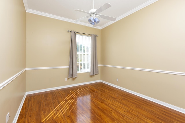 spare room featuring hardwood / wood-style floors, crown molding, and ceiling fan