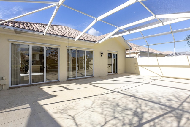 view of patio / terrace with a lanai