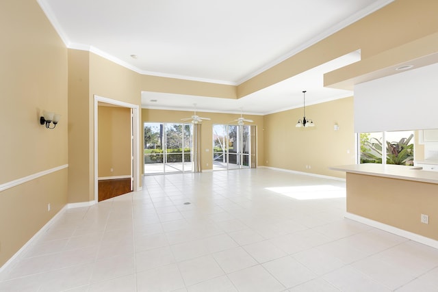 tiled spare room with crown molding and ceiling fan with notable chandelier