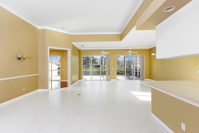 spare room with ornamental molding, light tile patterned flooring, and ceiling fan