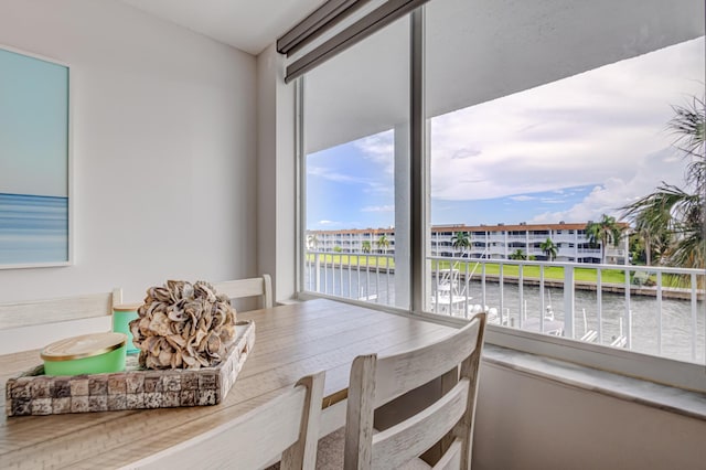 dining space featuring a water view