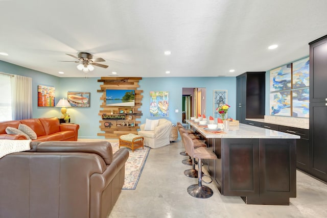 living room with ceiling fan